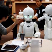 Robot waiters work at Tokyo café