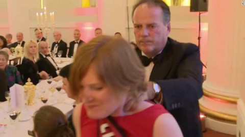 UK Foreign Office minister forcibly leads activist woman out of room