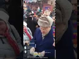 Zhirinovsky handing out banknotes at Red Square