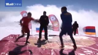 Russian and Armenian wrestlers battle on top of Elbrus