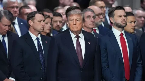 Trump caught handing out breath-freshening candies at memorial service for Senator Lindsey Graham