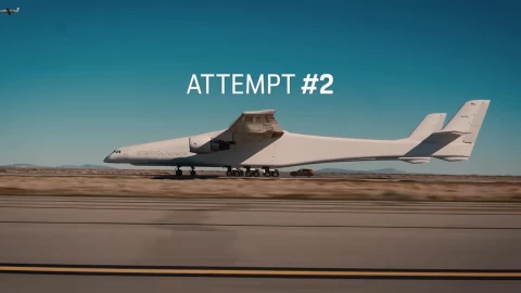 Porsche Cayenne electric car drives underneath the world's largest aircraft while it takes off